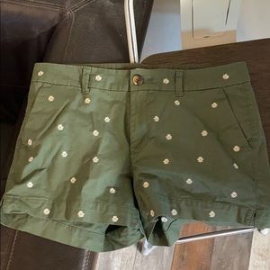 Army green shorts with daisy embroidery detail